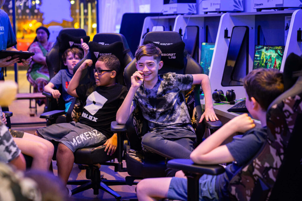Esports Academy - a group of children sit in a circle during their esports academy class